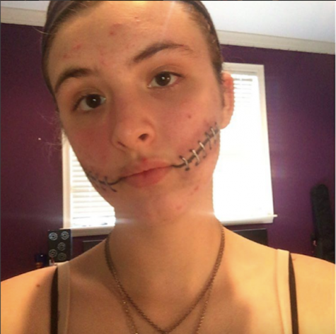 Traud shares, "For this stitched smile effect, all I used was eyeliner and eyeshadow." Credit: Olivia Traud