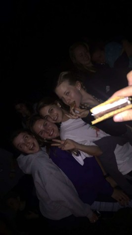 Making s'mores with all 99 sisters. 