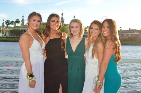From left to right seniors Megan Bajo, Lily Oliva, Christina Thompson, Carolina Oliva and Gabby Accardi pose for a photo at Jesuit prom. Clearly their dates prioritized photo location, as Curtis Hixon Park is a popular and scenic location to snap some pictures before the dance.