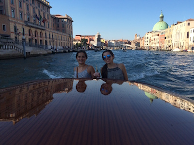 The Dingle twins travel through Venice on a vaporetto, a water taxi.