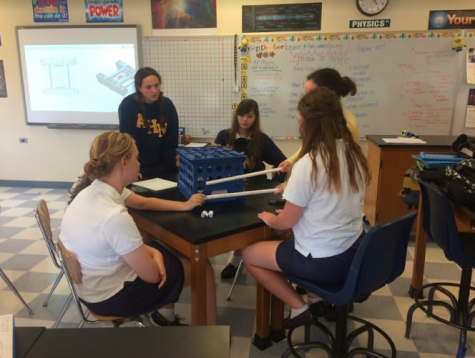 Senior Sarah Tevlin and other Robotics club members are hard at work coming up with new ideas for their robots for this season. Photo Credit: Meredith Butler (used with permission)