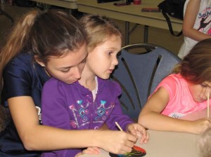 Claire Cardillo and 1st grader work on crafts together