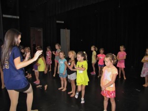 Gaby Ruiz reviews the dance moves with her campers