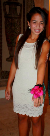 Alexis Ercia wears a beautiful white, lace dress.