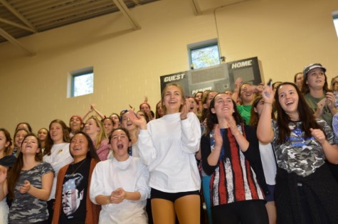 Seniors cheering on their fellow classmates while they compete in dance competitions