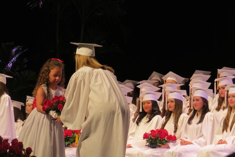 AHN's first grader gives Cecily Curtis her bouquet of roses.