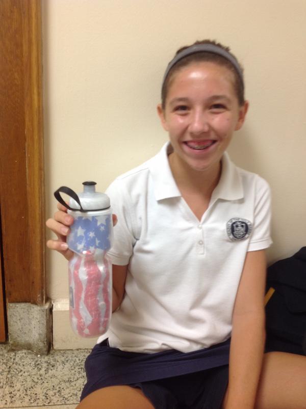 Emma shows how happy she is with her patriotic polar bottle.