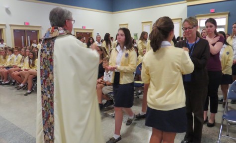 Fr. Bruce giving the Body of Christ 