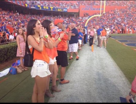 Senior Isabella Alfonso cheering on the Gators last season from the end zone.