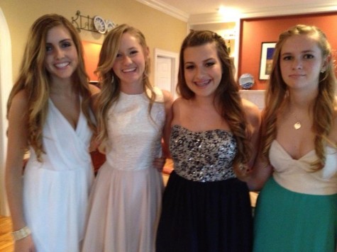 Senior Jackie Joyce, third from the left, wearing a strapless sparkle dress freshman year