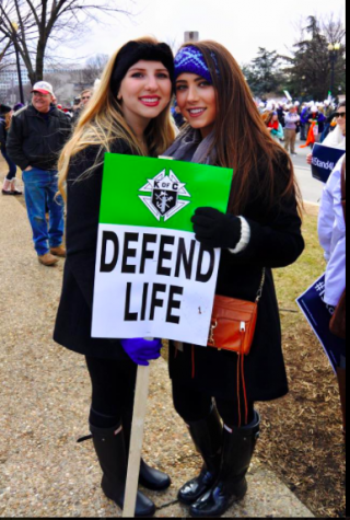 Natalie Cevallos and Lily Oliva defending life at March for Life this is through the Respect for Life Club
