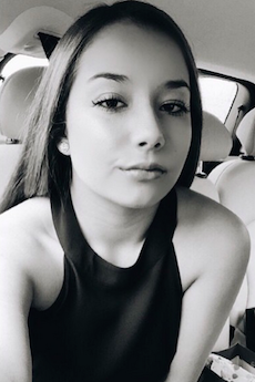 Sophomore, Francoise Corser gives the camera a fierce selfie while rocking an equally as fierce middle-part.