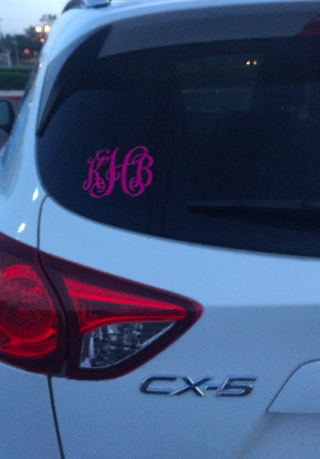 Senior Kelsea Henry sports a pink monogram on the back of her Mazda. Photo Credit: Kelsey Henry