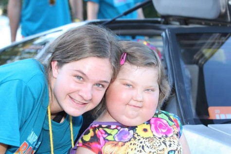 Lizzie and her camper, Liza, pose for a picture at camp in Seattle!
