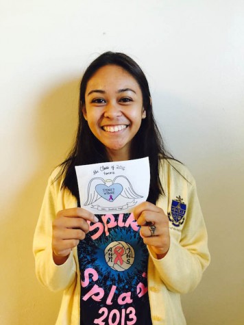 Senior Alexis Markines holds the final product of the sticker. Credit: Jacqueline Brooker