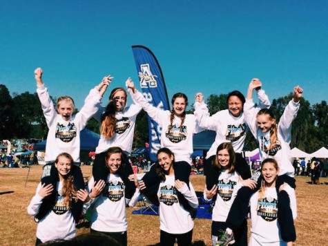 2014’s cross country team all gathering after a successful day of running and cheering everyone on Photo Credit: Jaime Jurado