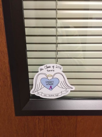 AHN's assistant principal, Erin Krukar, promotes the sticker by placing it on her office door. Credit: Jacqueline Brooker 