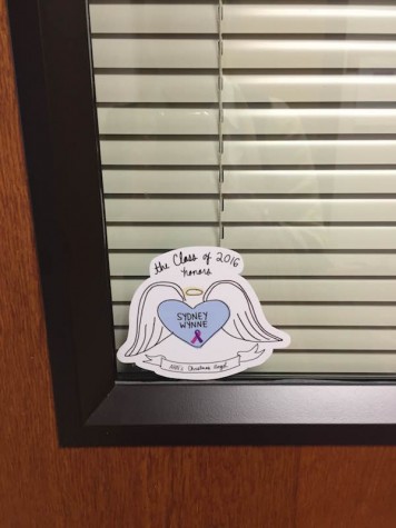 AHN's assistant principal, Erin Krukar, promotes the sticker by placing it on her office door. Credit: Jacqueline Brooker