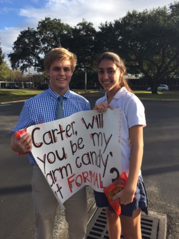 Sophomore Katherine Hahn asking her friend Carter Anderson to Christmas Formal with his favorite treats.