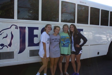 AHN swim girls stop for a quick picture before the long ride to Stuart, FL. Credit: Gabby Delp 