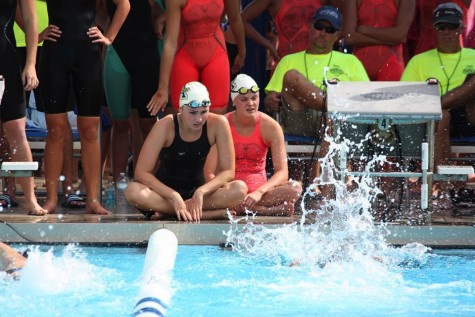 Sophomores Gabby Delp and Isabella Kirkpatrick are in the zone while preparing for their race