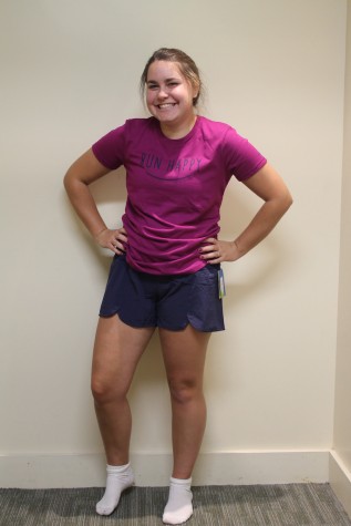 (Photo Credit: Keri Kelly) Junior Rachel McKenna models a lightweight outfit perfectly suited for running. Shirt: $30.60 from Fit2Run Shorts: $48.60 from Fit2Run