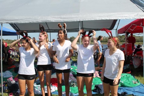 Freshman look for santa (their coxswain Teresa) in the crowd of rowers. 