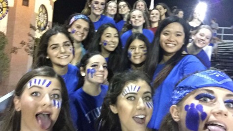 Senior AHN girls cheering on their friends to a 35-20 victory over TC for 16 straight years!