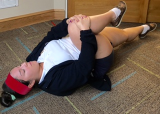 Make sure the leg that is resting on the ground is straight down for a complete stretch!