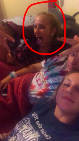 Grace Toups, Gracie Minton, and Alex Perez pose for a lazy coach picture after watching a movie.
