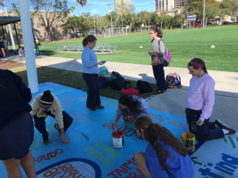 Some of the seniors look extremely concentrated as they carefully draw their names on the blue pavilion.