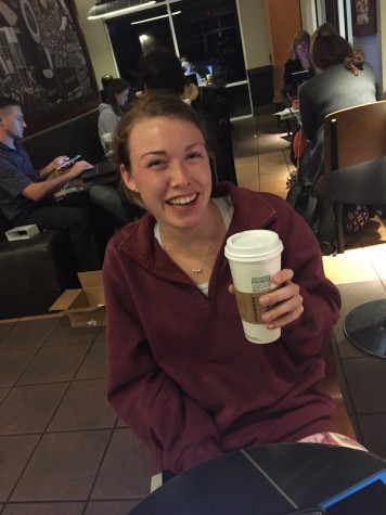 Credit: Rachel McKenna/Achona Online Abby Morris smiles with her Molten Hot Chocolate even though she believes it lacks a few ingredients, like more sugar.