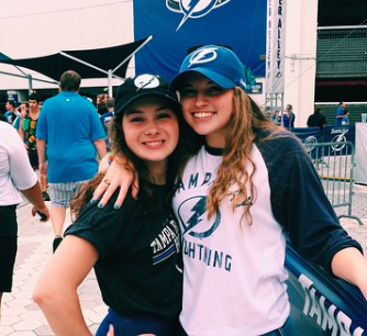 Seniors, Karlee Nipper and Jacqueline Brooker rock the hat trend at a Lightning Game! 