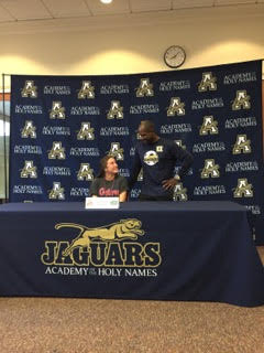 Lester (pictured with her high school coach Kareem Escayg) says, "Finally being able to one hundred percent commit to UF is an awesome feeling and its exciting because its a step closer to being there for during the summer. "