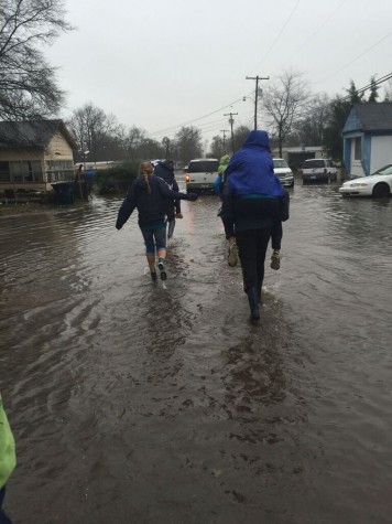 The water was so high at points, the group could not drive the cars to the work site and were forced to walk.