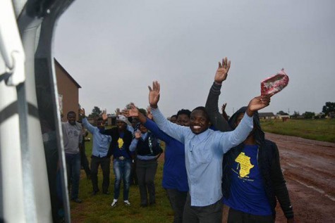 The students wave goodbye to the missionaries as they leave the school.
