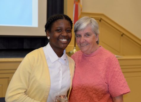 Chant Belcher poses with Sister Ann Regan after winning the Freshman of the Year Award to end her Freshman year.