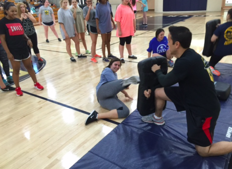 Senior Maddie Matesich lets out stress while learning to properly defend herself. Credit: Brian Butterly 