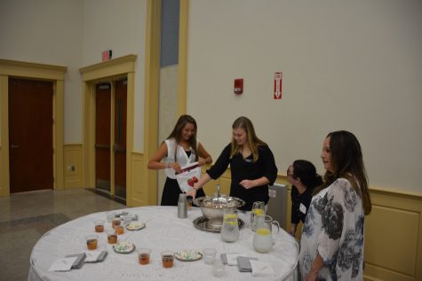 (Photo Credit: Lindsay Calka/Used With Permission) Junior Ambassadors Gabbie Ragano (left) and Laura Henry help make the punch for the coffee.