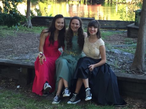 Seniors Julianne Nichter, Sarah Tevlin, and Isabella Cartaya (pictured from left to right) sit down before prom to show off their bold choice of footwear. Photo Credit: Jen Nichter (used with permission) 