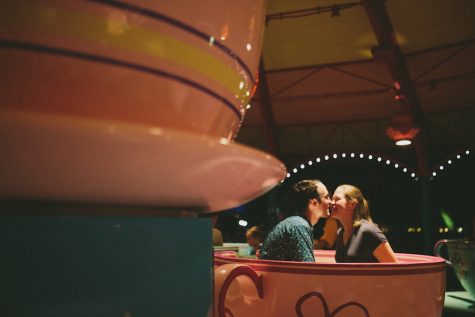 (Savannah Lauren/http://savannahlauren.com) After Ms. Mikos became a fiancė, her and Wynn adjourned to the teacup ride and watched the night parade. 