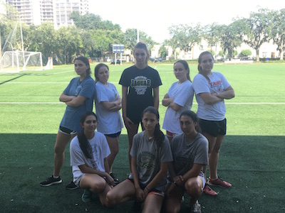 After a tough workout in the heat, the team strikes a serious pose.