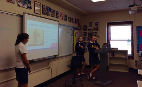 Sophomores Caitlyn Asher (left), Jaclyn McCauley (middle), and Sydney Lowman (right) presenting their project on the the fifth proof, Grand Designer. 