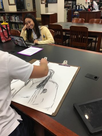 Garcia smiles as her artist, Ruppell, paints her hair