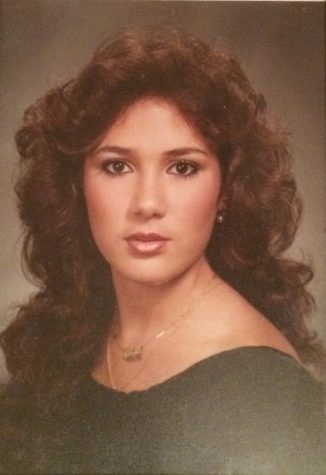 Alexis Alvarez's mother, Maria Alvarez, strikes a pose for her senior picture.