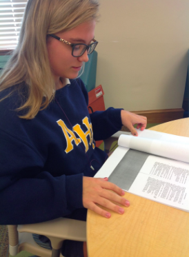 Junior, AnnMarie Collins, studies her lines to prepare for her role as Mickey. Photo Credit: Sara Phillips/AchonaOnline