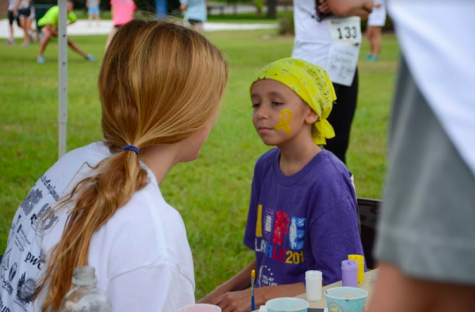 The president of Cross Out Cancer, senior Lizzie Dolan, hopes more cancer patients and their families attend the race, so participants see the people they are helping.