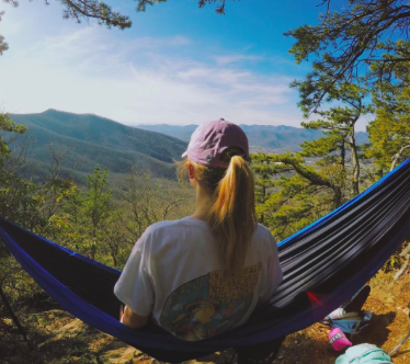 McKenna Weathers sits back and admires the Black Mountain view after a hard day of service work. 