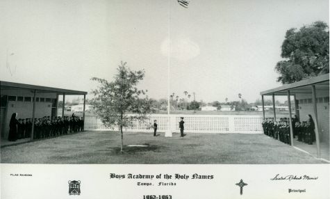 A flag raising ceremony for the Boys Academy, located near the current softball field.