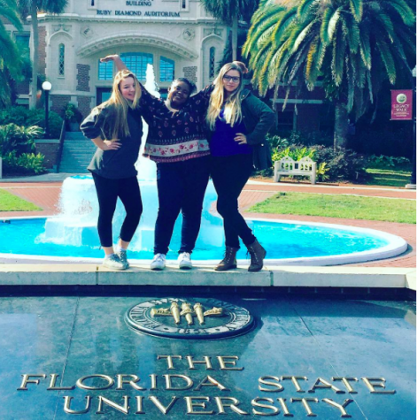 Anabella Ebsworth, Nyla Jacobs, and Julia Barreto pose in front of the University on their first day 